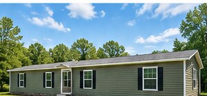 Manufactured home set on a grassy site, installation concept